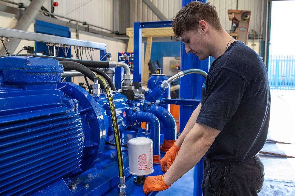 Man working on blue power pack