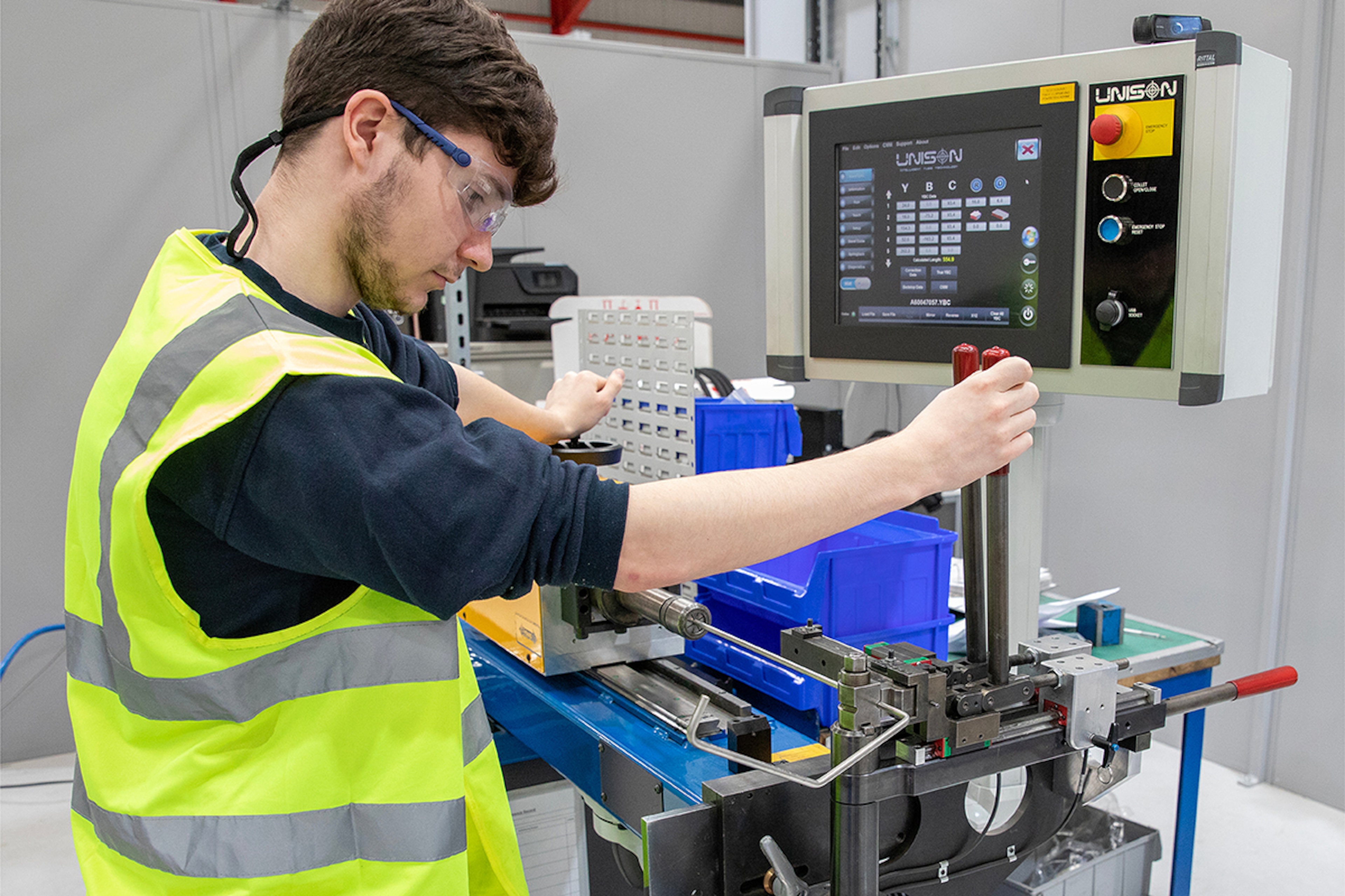 Flowtech engineer in a workshop